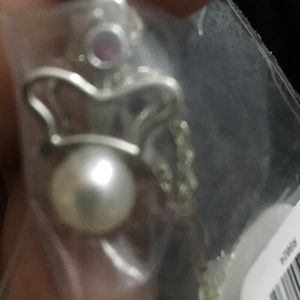 Crown with a stone and pearl